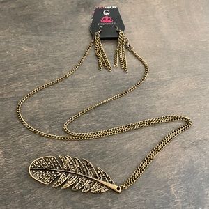 Brushed faux bronze long necklace with beautiful feather and matching earrings.